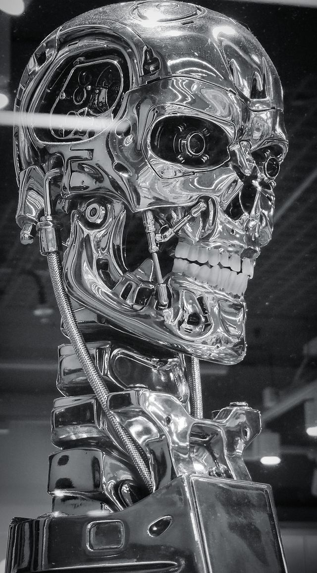 Black and white photo.  Metal bust of "Terminator 2". World cinema
