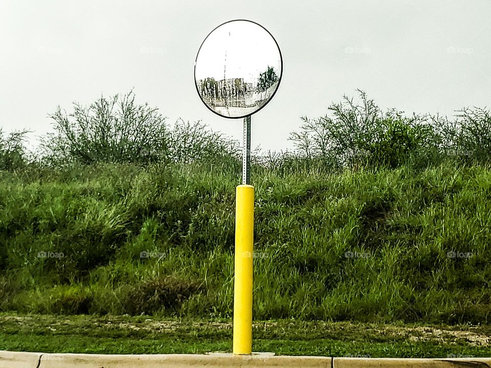 Mirror capturing gloomy wet weather