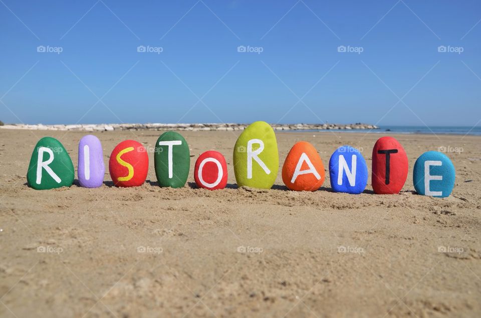 Ristorante word on colourful stones
