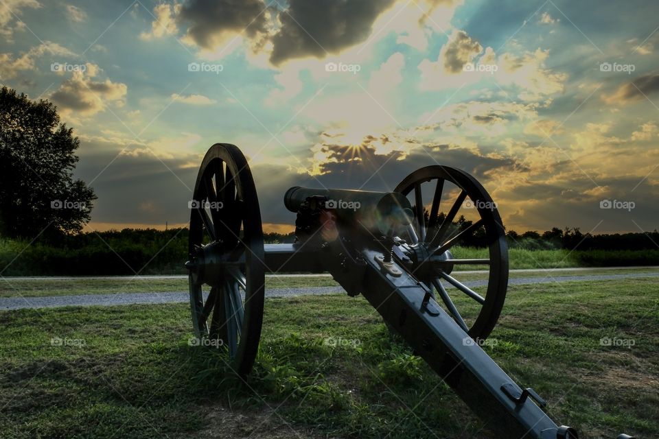 An old cannon points towards the sunset at Stones River National Battlefield in Murfreesboro Tennessee. This battle had the highest percentage of casualties on both sides of any major battle in the American Civil War.