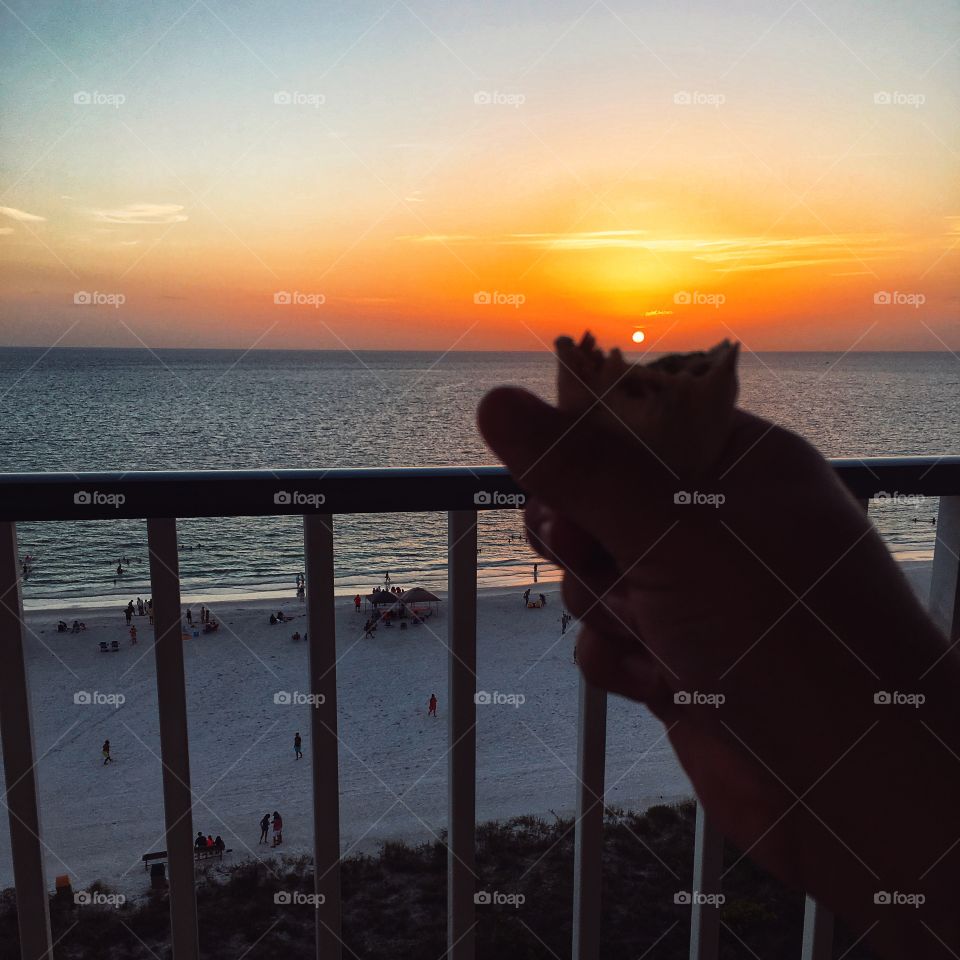 Playing with food as the sun sets on the beachy horizon 