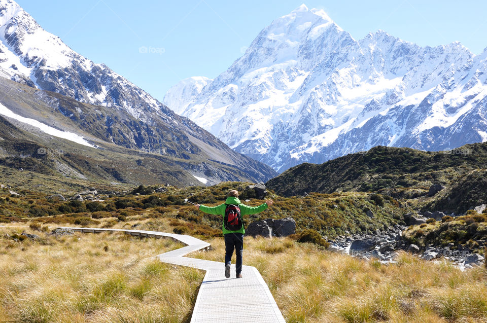 hiking in the sun in snowy mountains