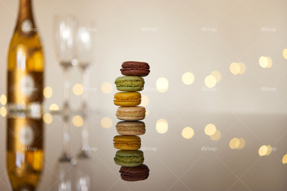 French macarons on a reflective glass table top