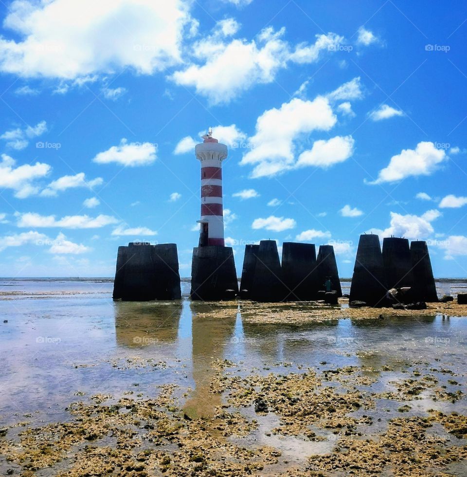 The beautiful image of the Ponta Verde lighthouse, Maceió -Alagoas -Brazil. With low tide you could walk to the lighthouse and take beautiful pictures.