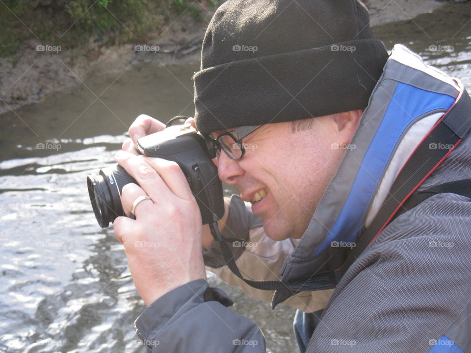 Close-up of man photographing