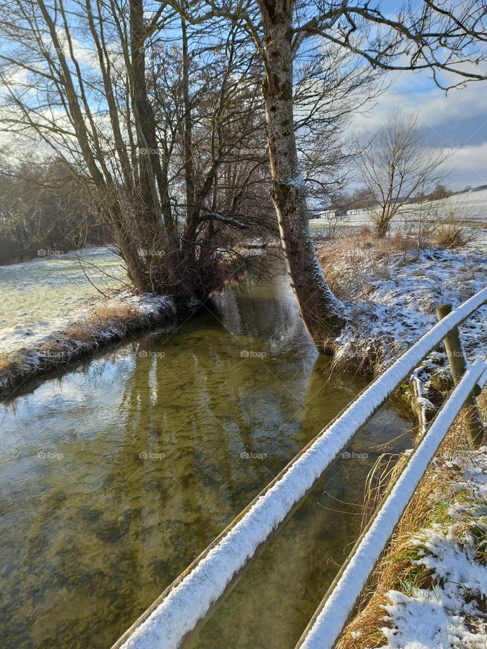 Fence by a Stream in Winter