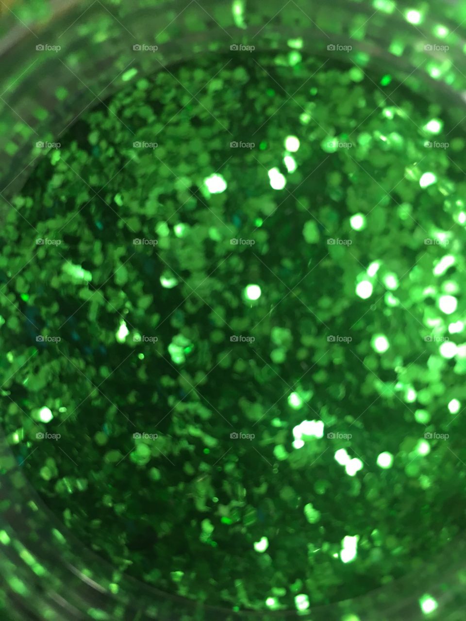 Looking into a jar of green glitter.  