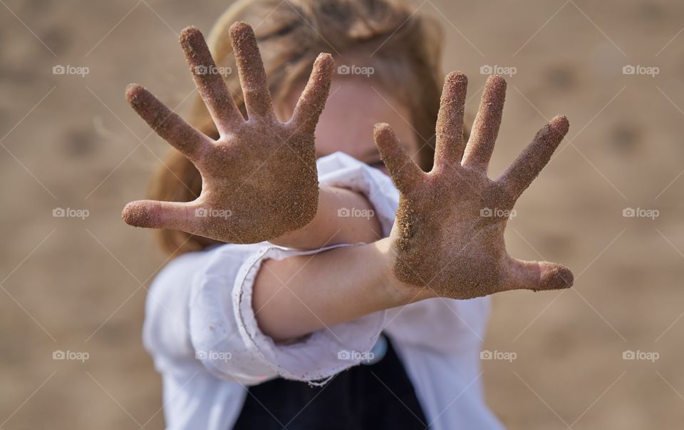 Sand in her hands