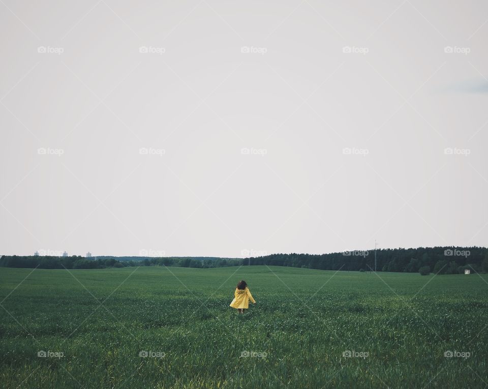 Girl running in the fields