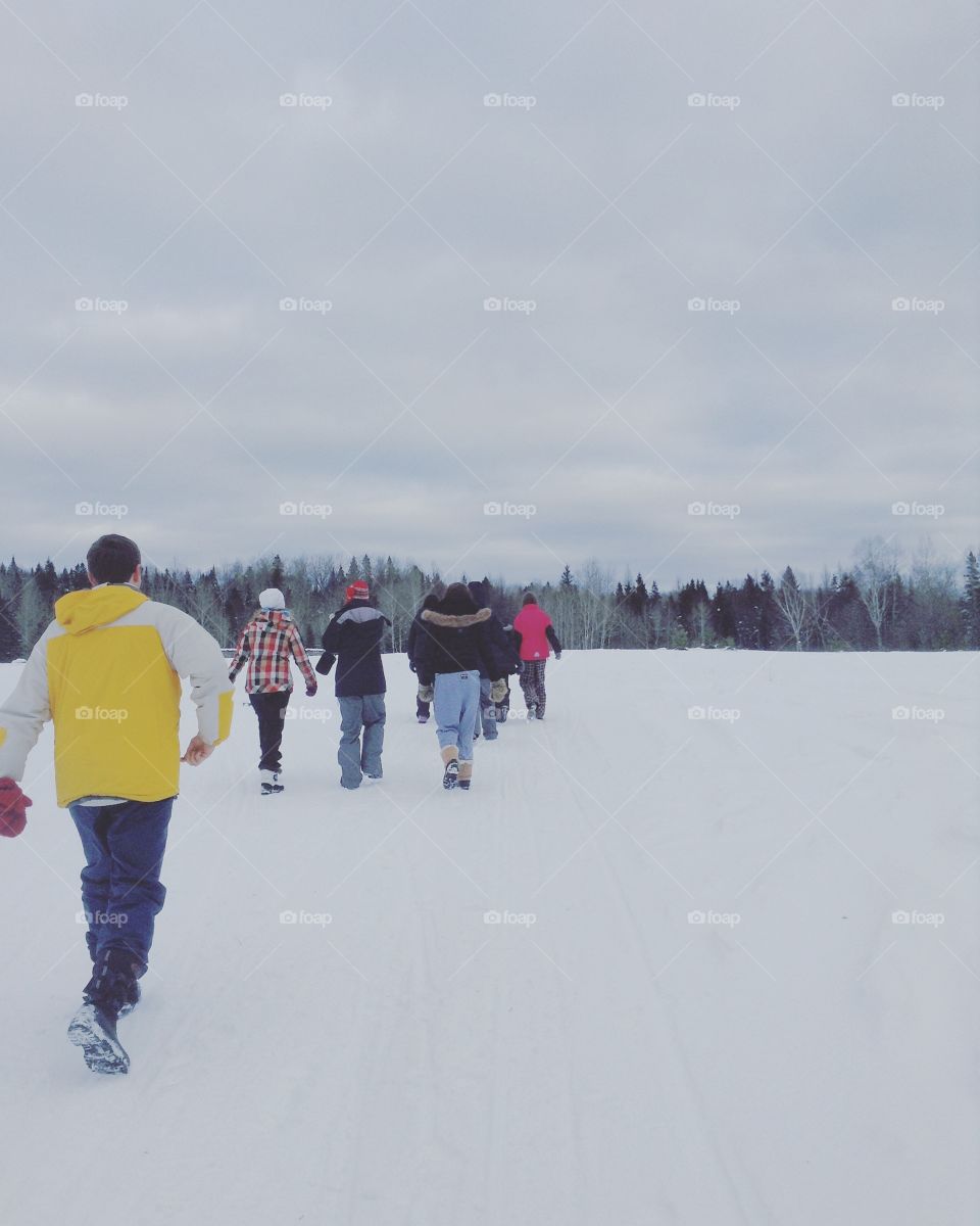 A group of friends walking winter hiking trails