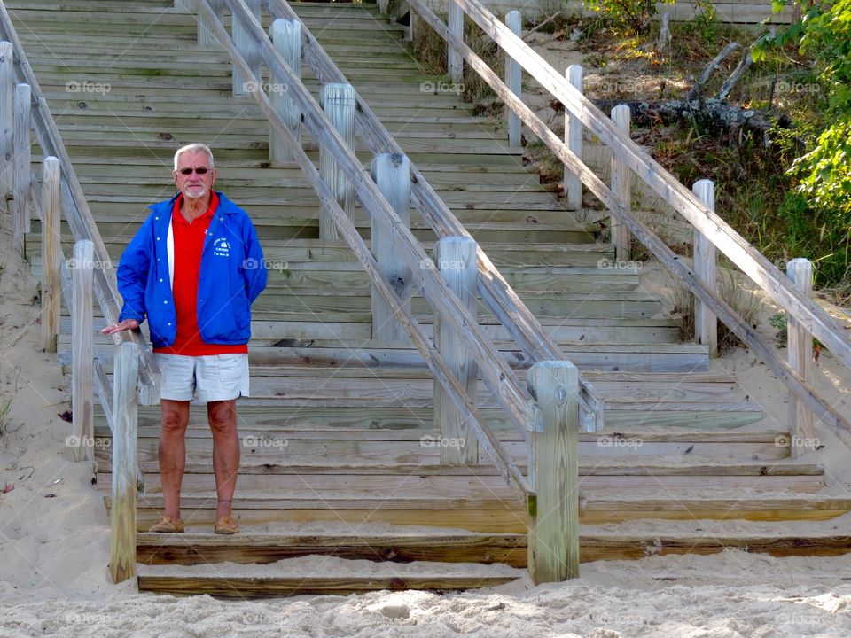 Man on stairs at beach. Man on stairs at beach