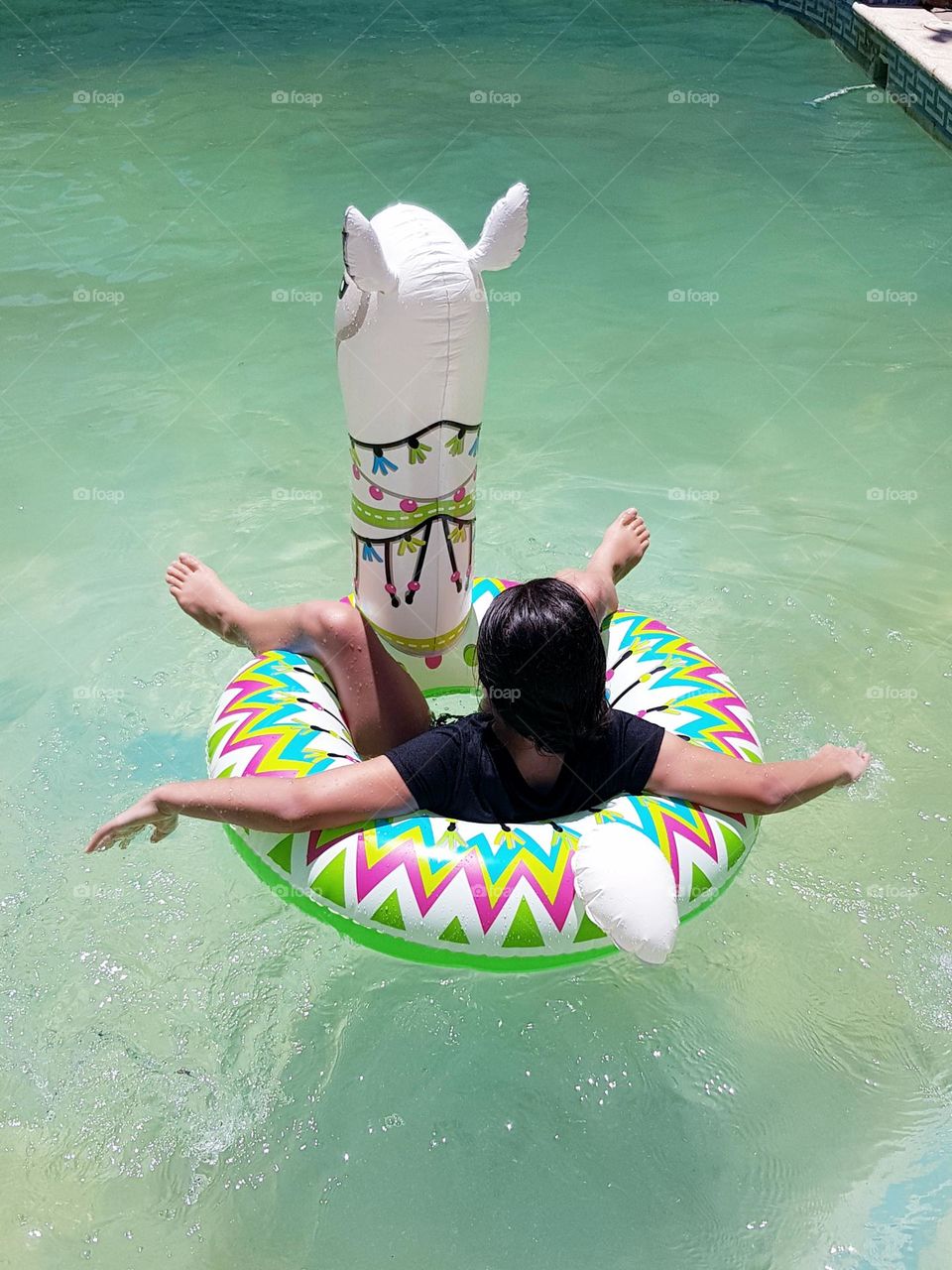 Just a girl floating around with her llama and her thought