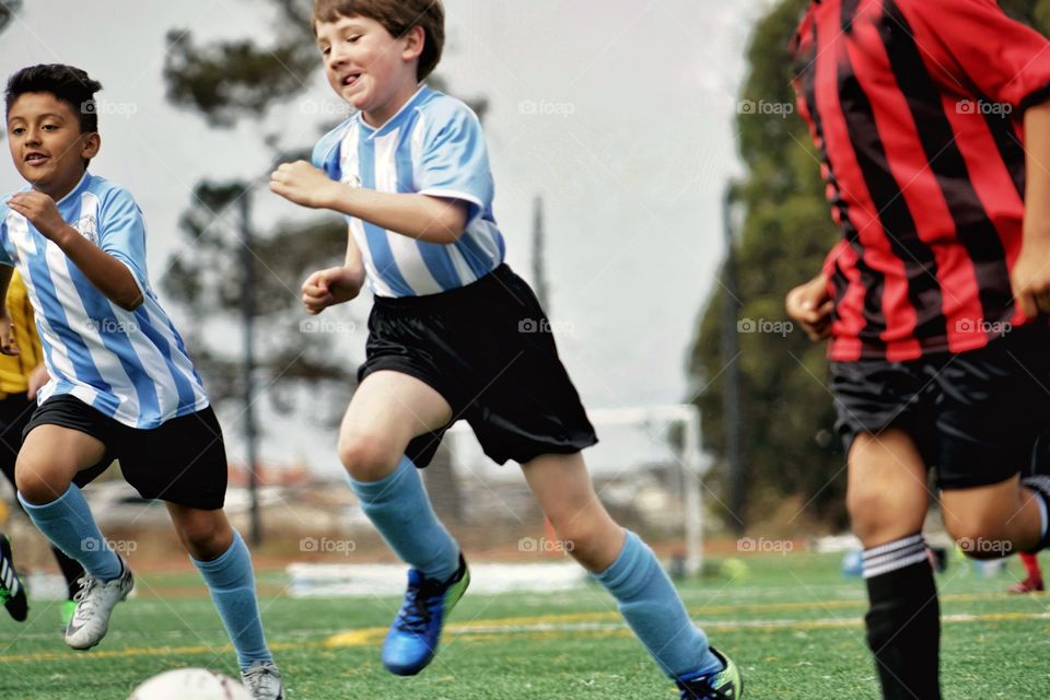 Boy Running For A Soccer Goal