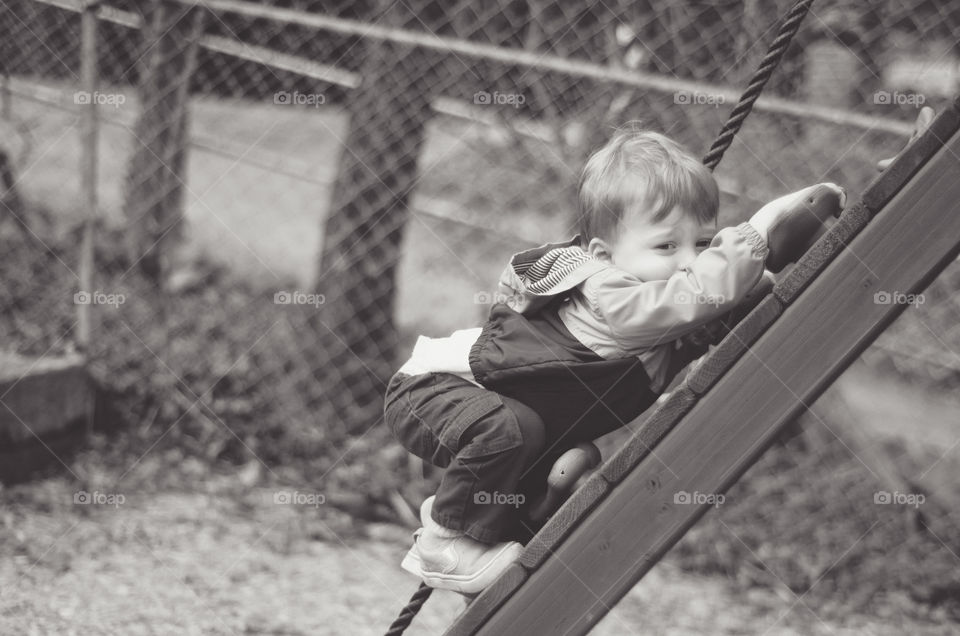 Little boy playing in playground