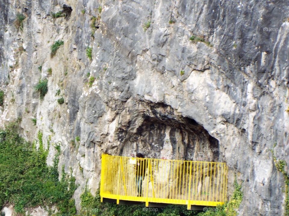 Yellow Fence in Rock