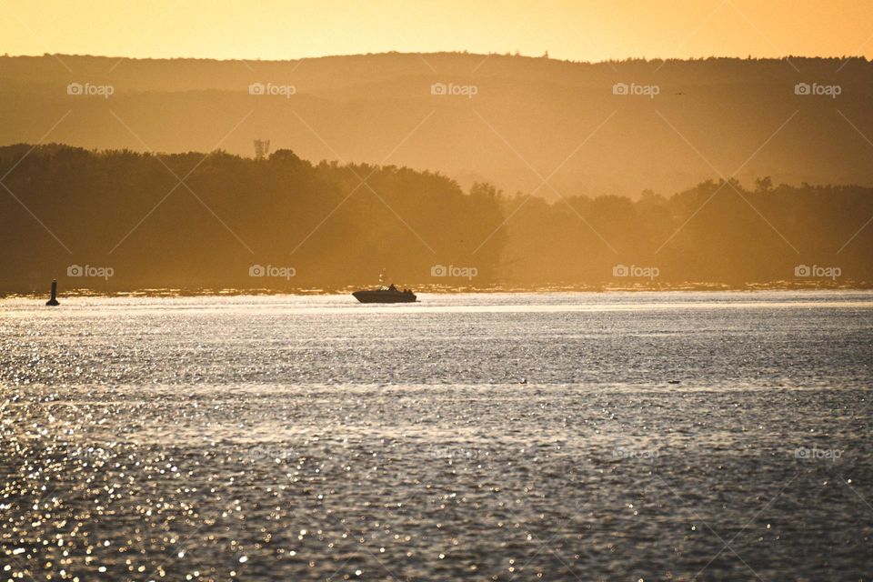 A boat on the river at sunset