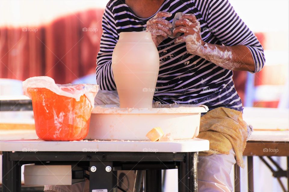 Potter working on making pot