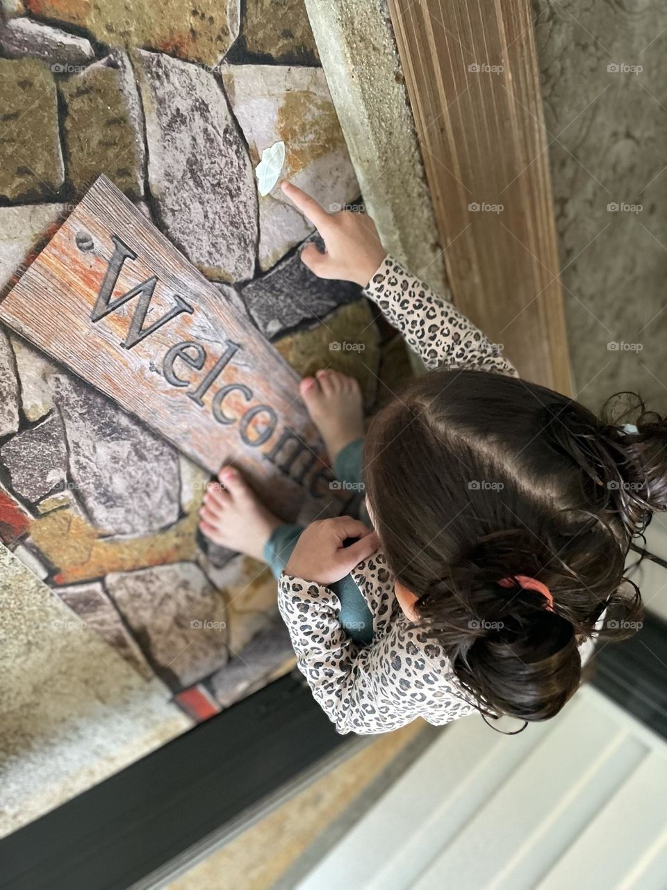 Little girl points to moth, finding moths outside, moths trying to get inside house, discovering nature with toddlers 