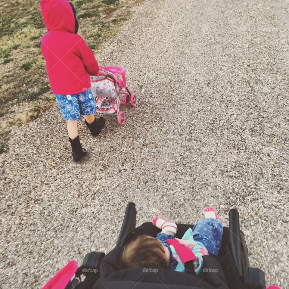 Two sisters taking a walk together.