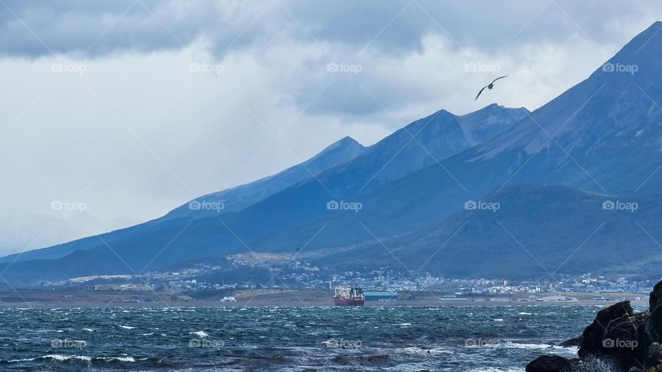 Strong waves moving the fishing boat that navigates the Beagle Channel in the city of Ushuaia in Tierra del Fuego, Argentina.  Also known as the southernmost city in the world.