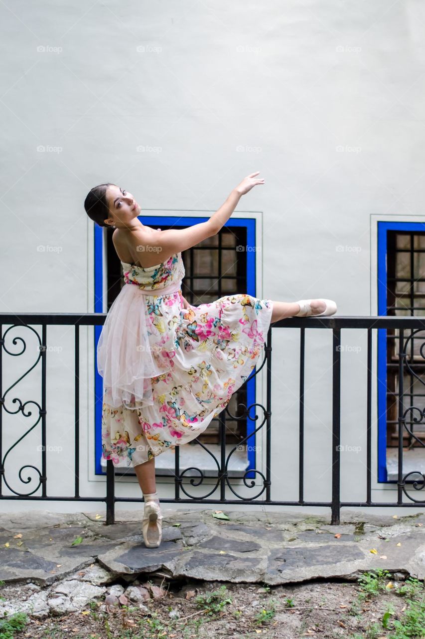 Young Female Ballerina Dancing Outside