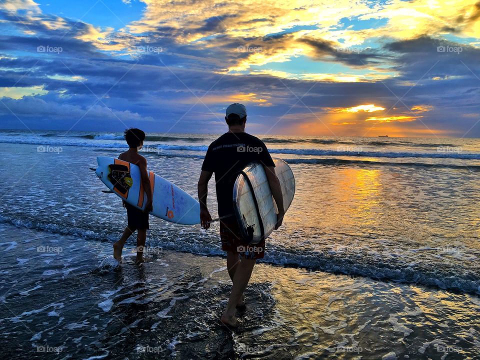 Father and son surfers