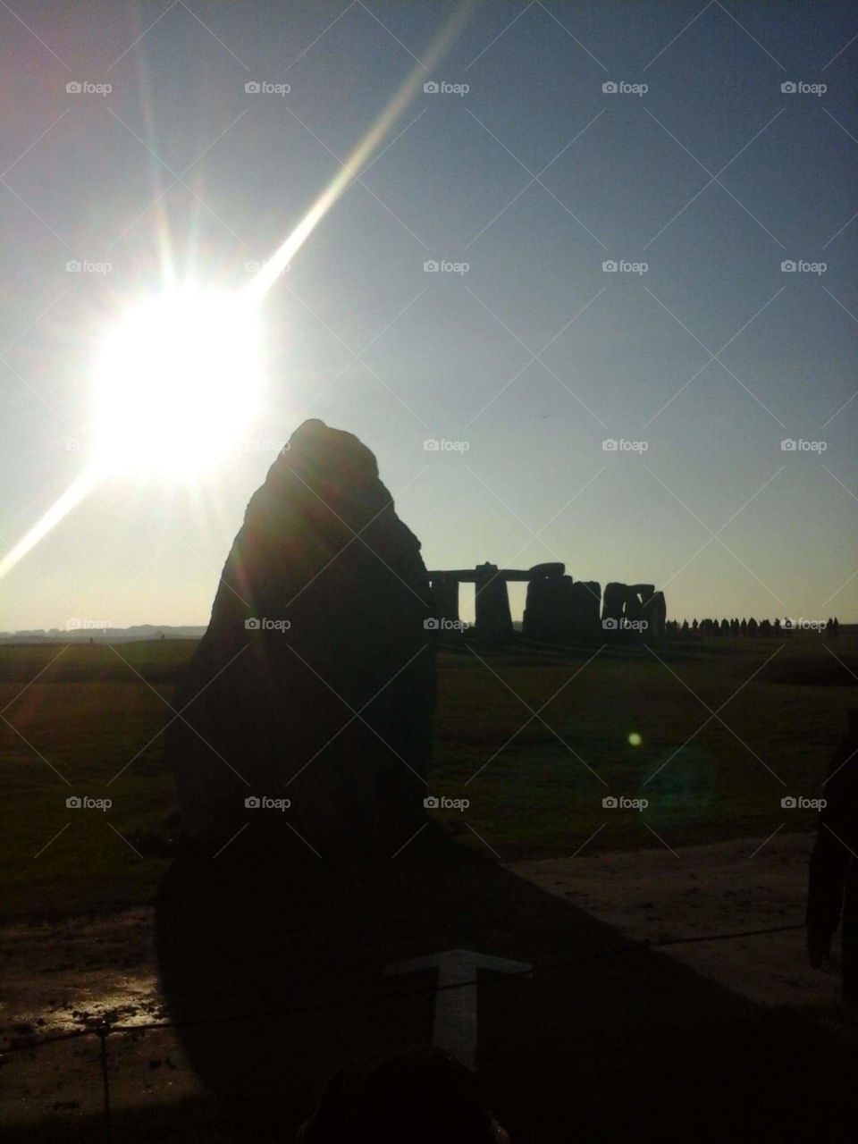 sun setting at Stonehenge
