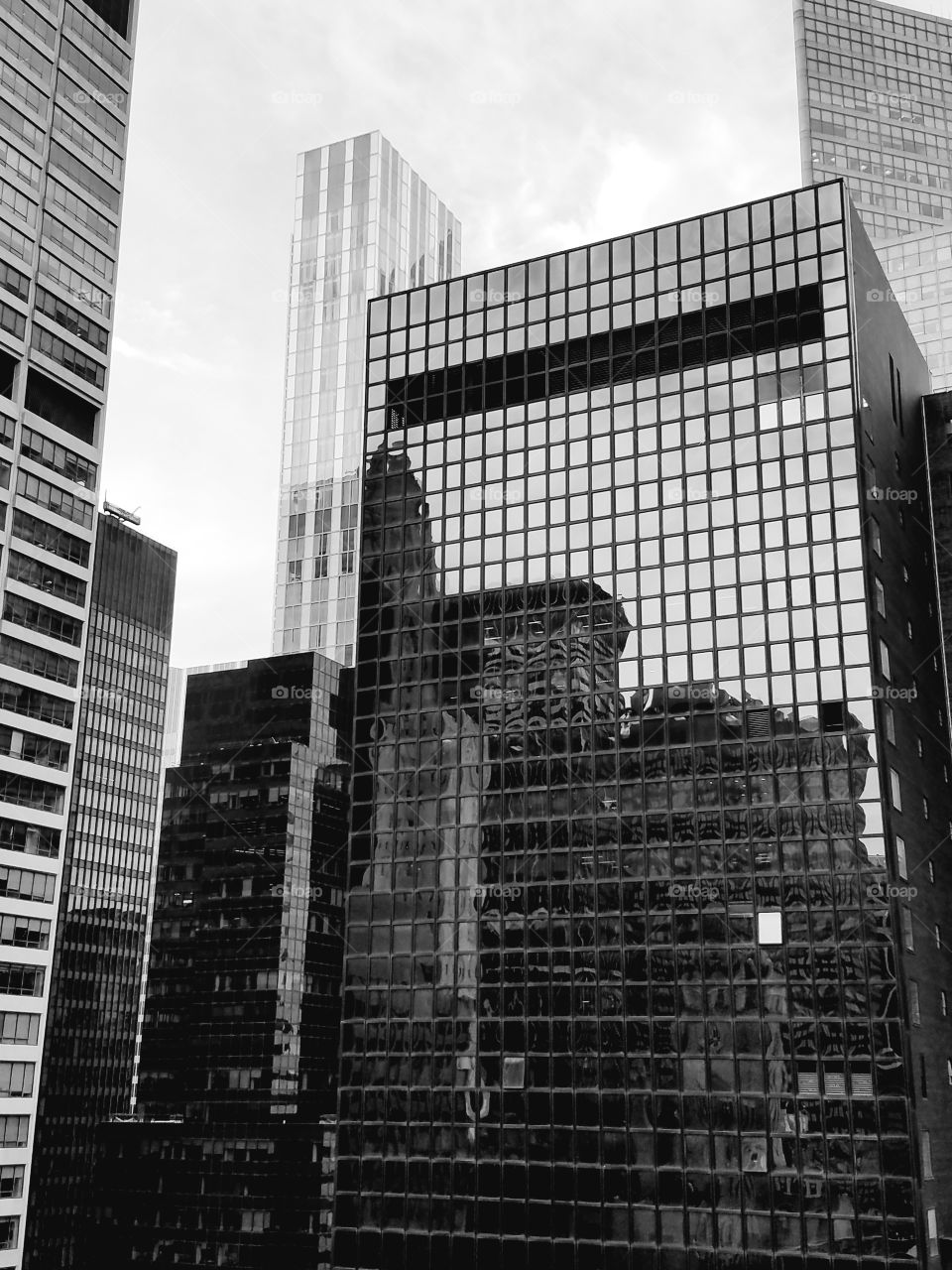 A black and white tribute to most famous cityscape in the world seen from the 30th floor balcony of the Kimberly Hotel.