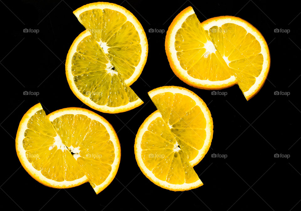 tangerine slices on a black background.  citrus backdrop