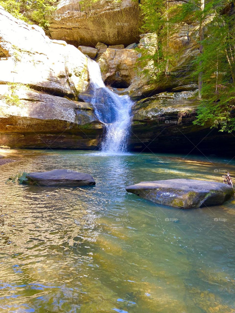 Cedar Falls in Hocking Hills Ohio…waterfall over rocky cliff with pool of blue water