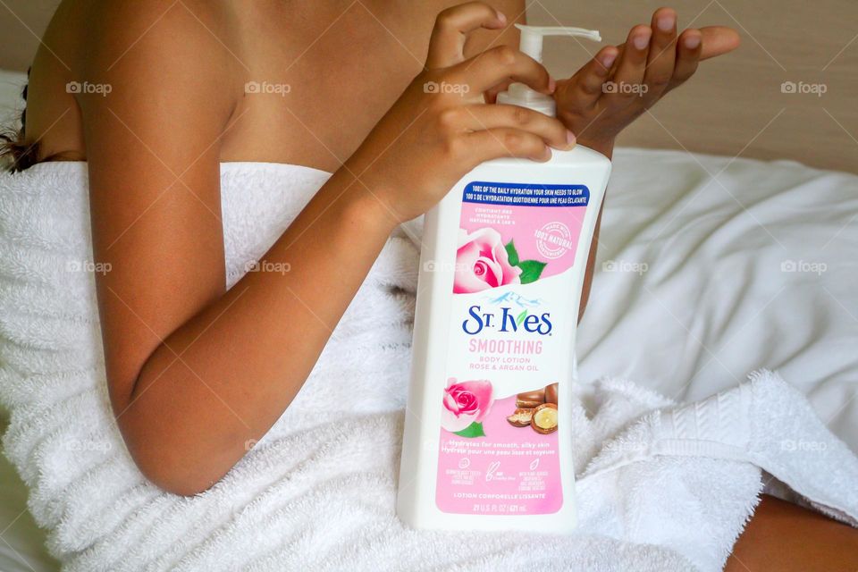 Hands using St.Ives skin care product