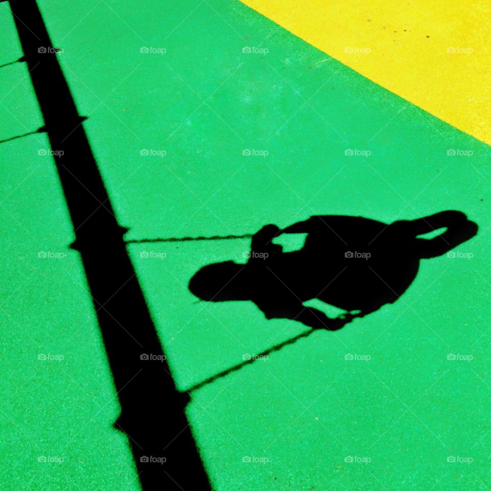 Shadow of girl swinging