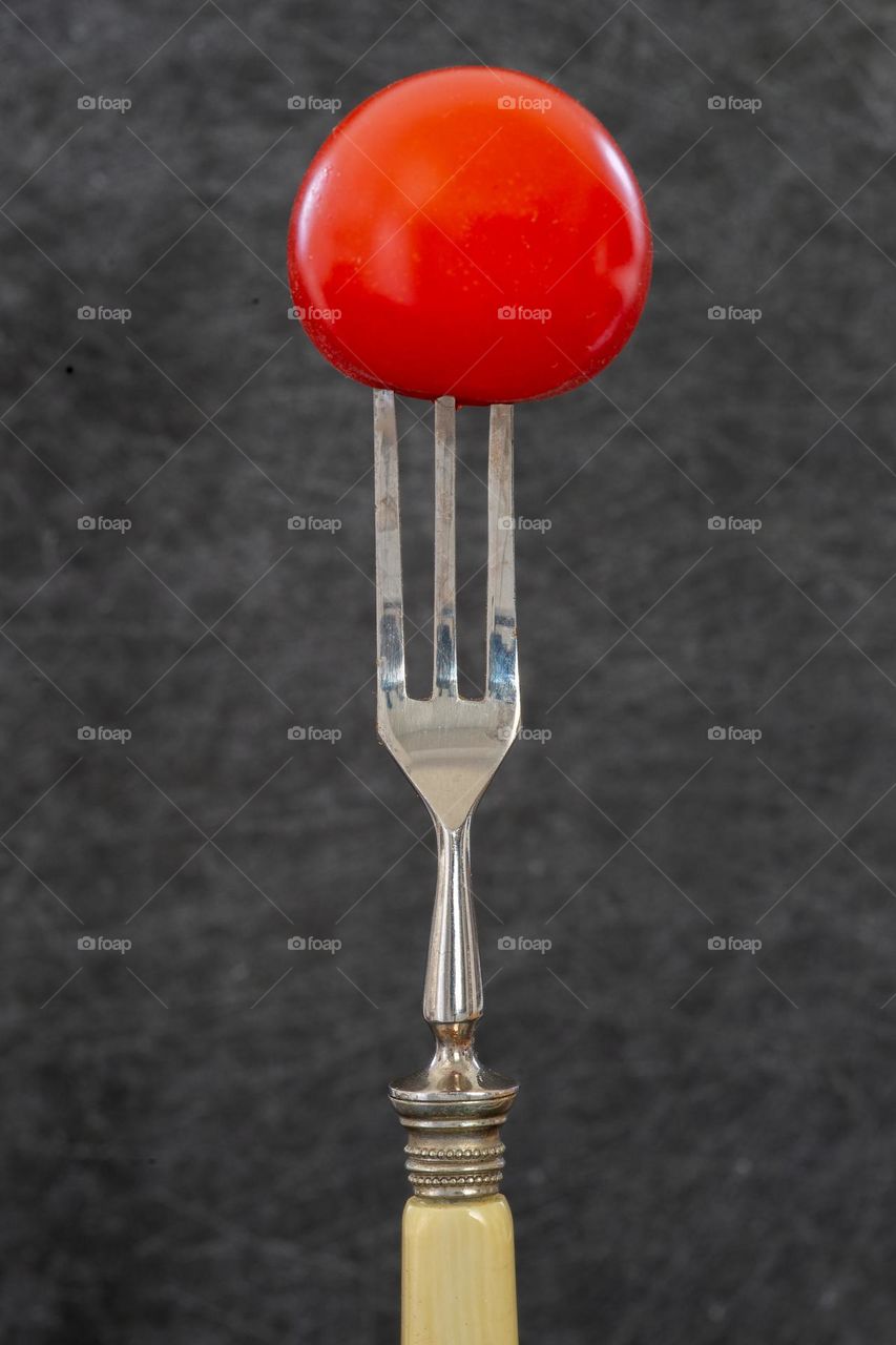fork and a tomato