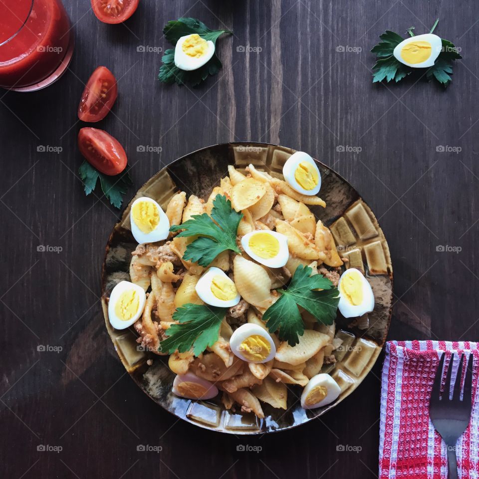 Pasta and eggs in plate