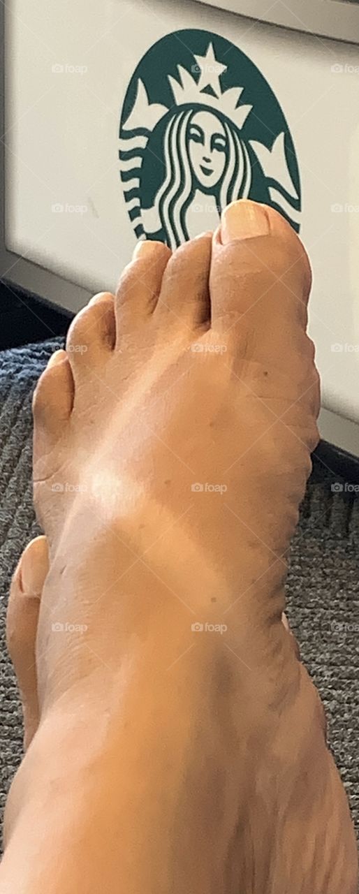 Feet with sandal tan.