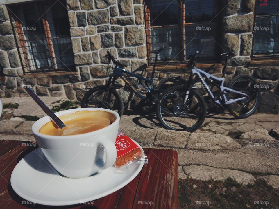 coffee on the table with bicycles on background
