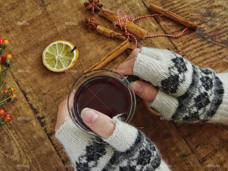 Holding a cup of tea