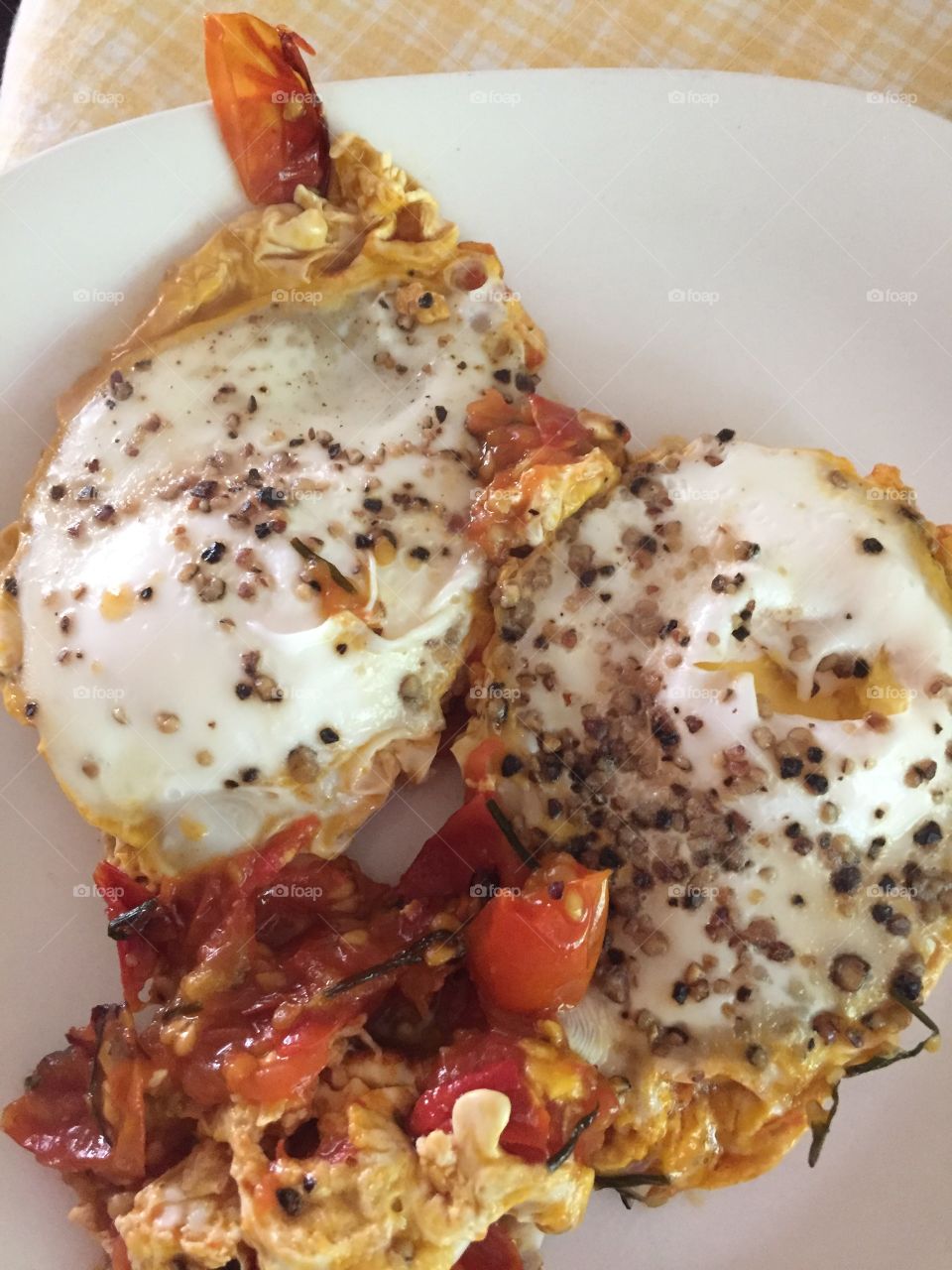 Eggs easy over with cracked pepper