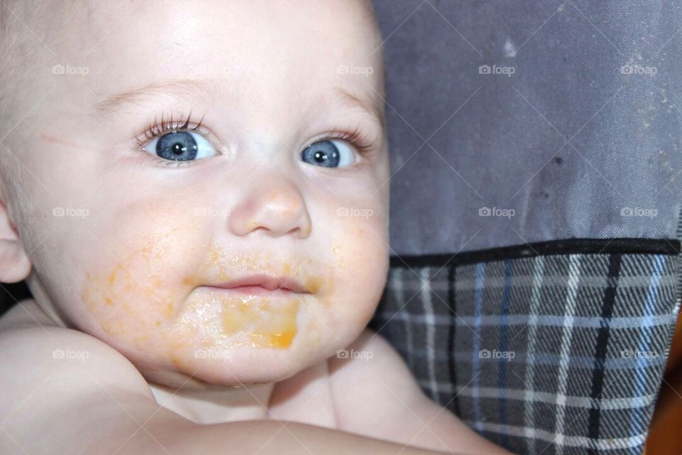 Close-up of a baby with messy face