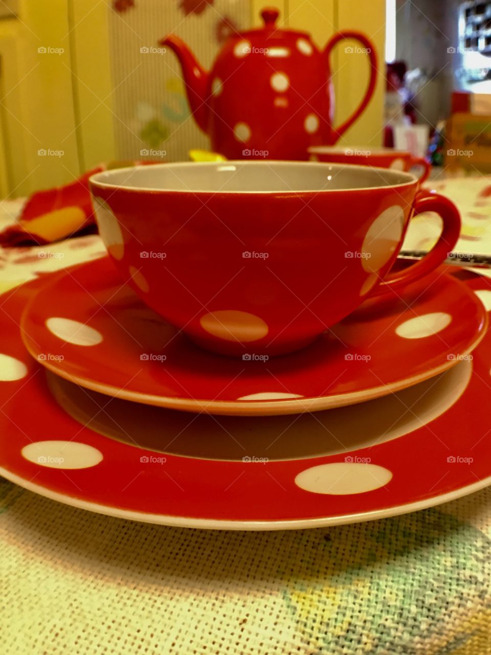 Red polkadot vintage or retro teapot, cup and saucer. 