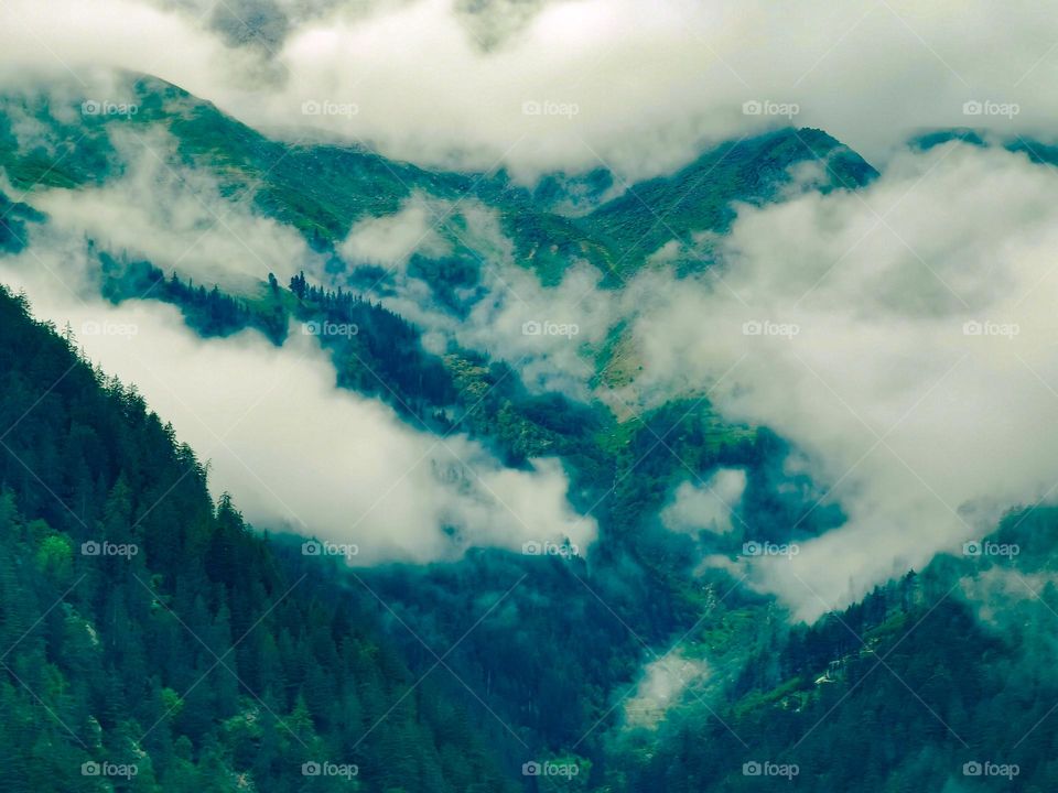 Clouds cladded mountain terrain