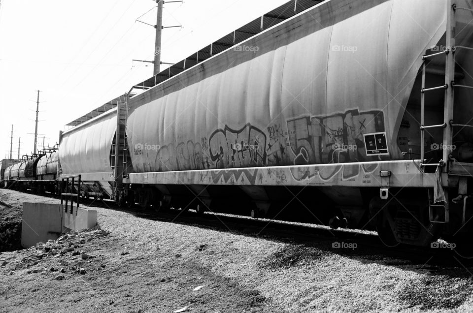 Black and white film tagged train car tank