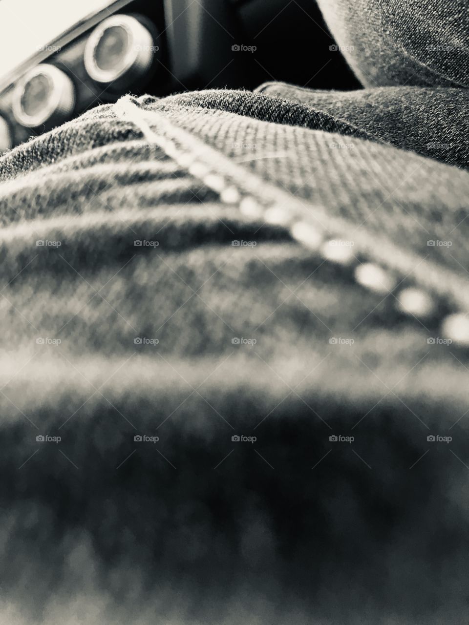 Side seam of jeans down the leg in the car in noir et blanc 