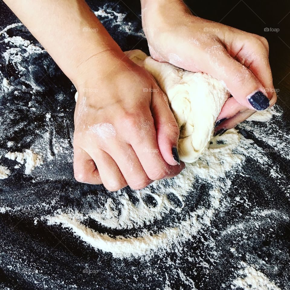 Hands on dough