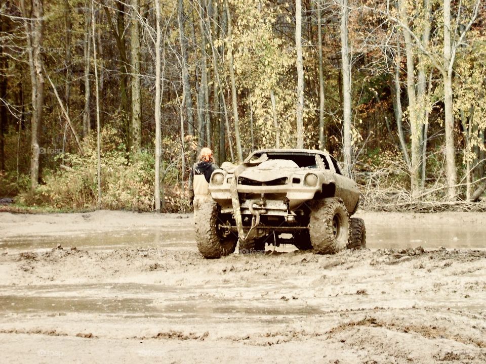 Mud Bogging. Old Chevy Camaro re-built to go off-road. Roll cage, big mud tires, good times out tearin’ it up!