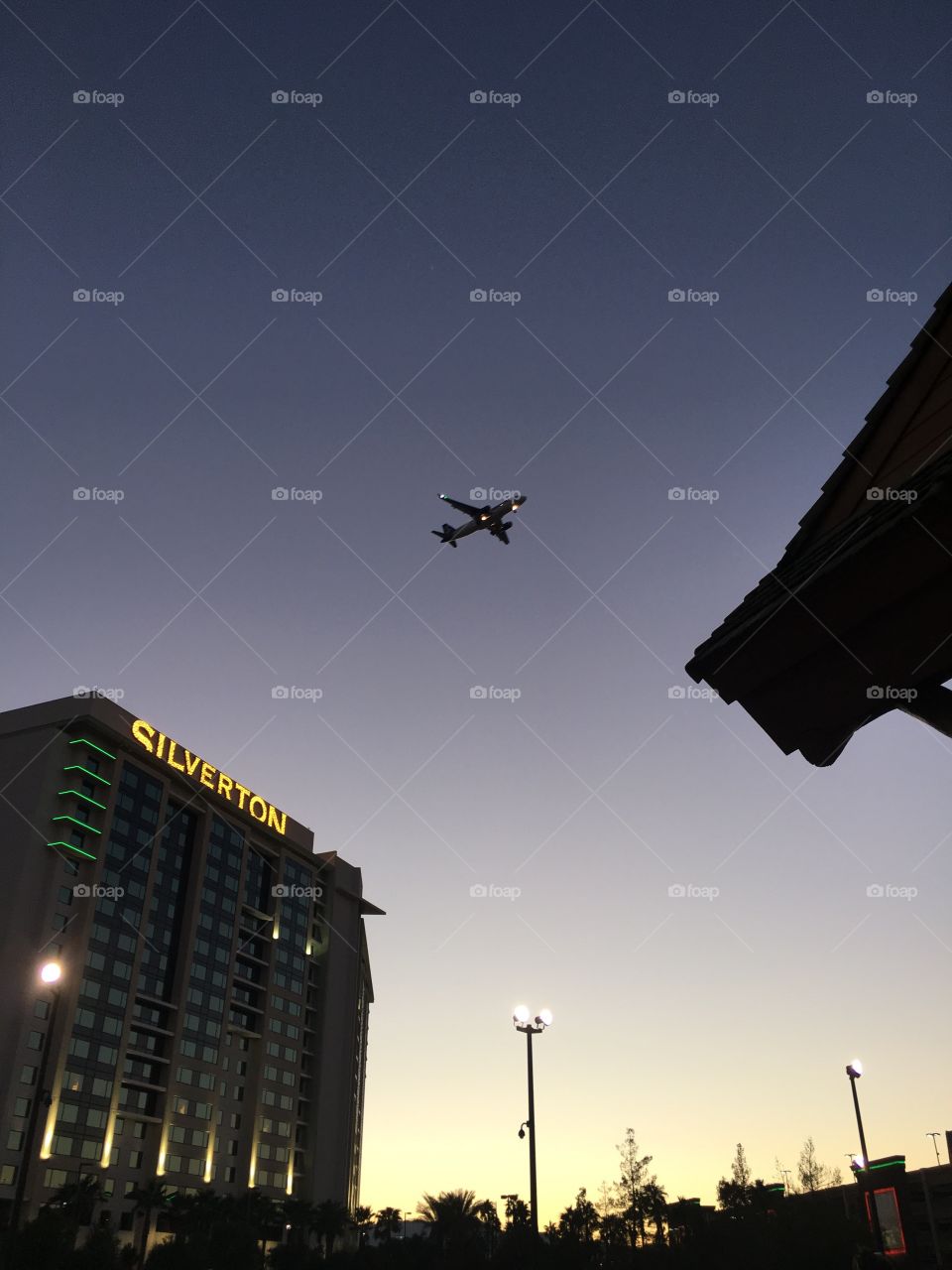 Watching planes fly overhead the Silverton in Las Vegas on a cloudless evening. 