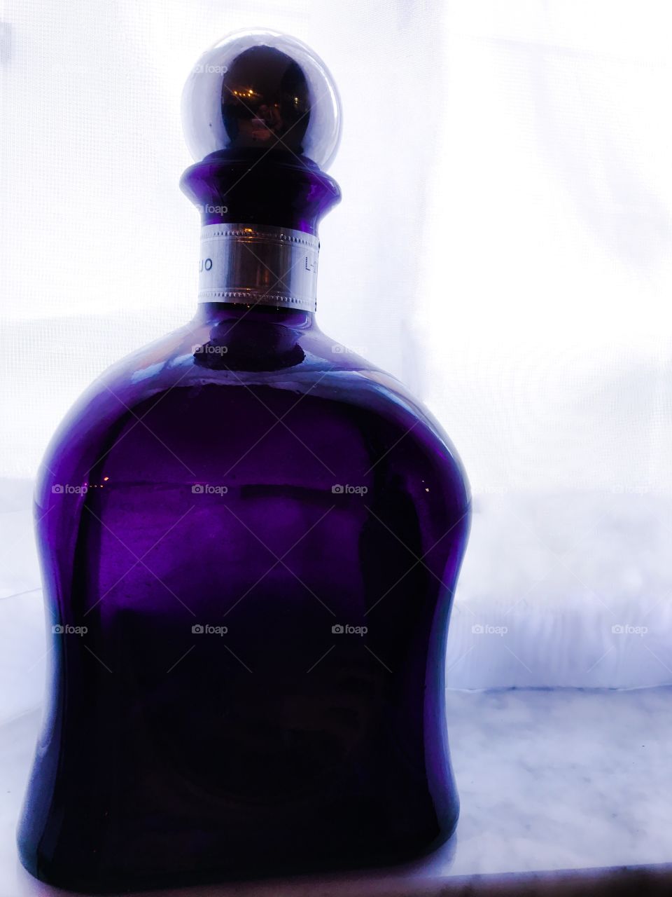 Purple glass liquor bottle 