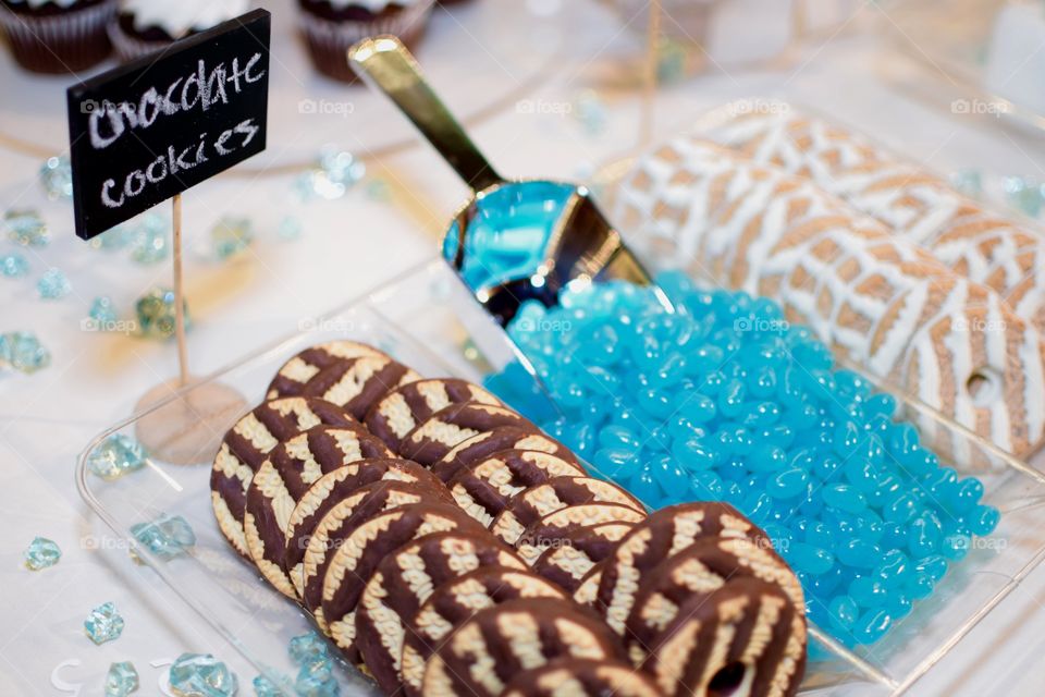 Tasty Cookies and candy on a tray with a scoop 