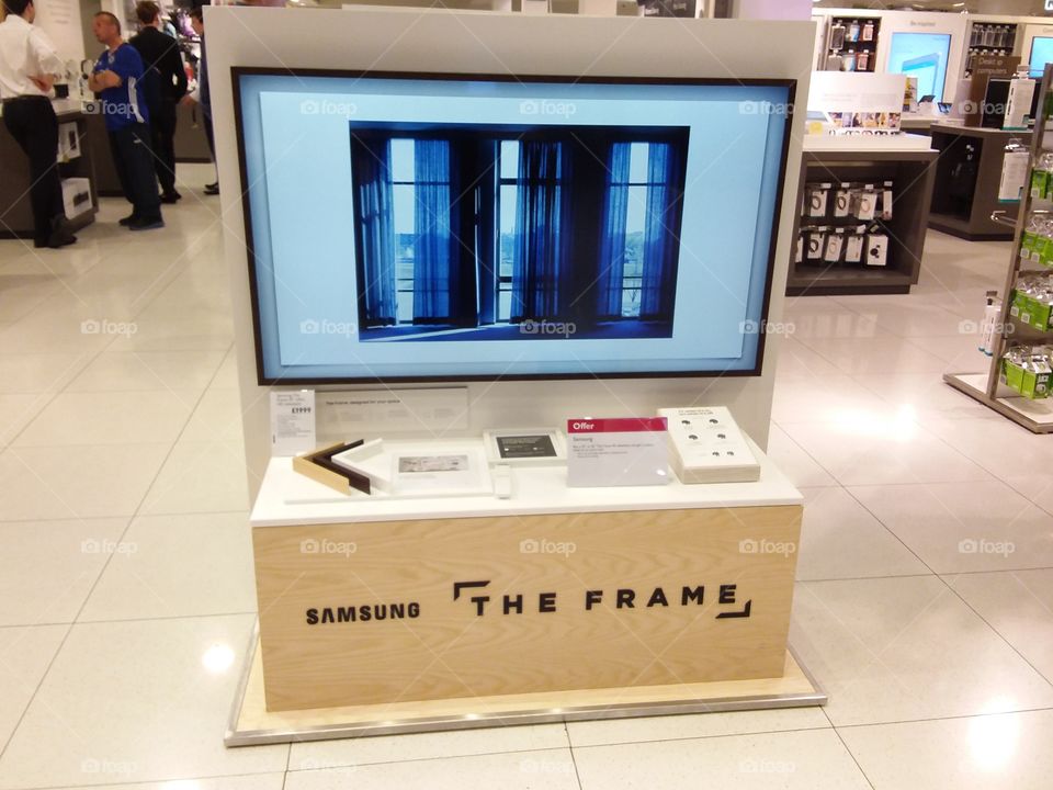 Samsung The Frame TV art mode television displaying a picture and bezels
