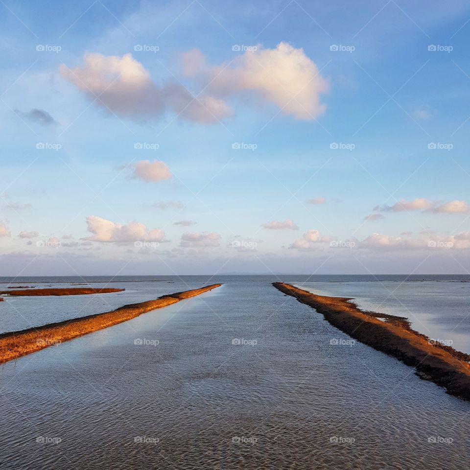Scenic view of lake against blue sky